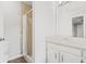 Neutral bathroom features a shower, vanity, tile and large mirror at 94 Park W Ave, Dallas, GA 30157