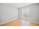 Bright bedroom featuring natural light, neutral walls, and hardwood floors at 94 Park W Ave, Dallas, GA 30157