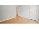 Bright bedroom with a wood floor and an open door at 94 Park W Ave, Dallas, GA 30157