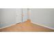A bedroom featuring two entry doors and hardwood floors at 94 Park W Ave, Dallas, GA 30157