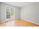 Bedroom featuring a large window, natural light and neutral paint at 94 Park W Ave, Dallas, GA 30157