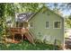 Exterior elevation of a home featuring a wooden deck with stairs at 94 Park W Ave, Dallas, GA 30157
