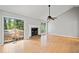 Bright living room with vaulted ceilings, a fireplace, and sliding glass doors to the backyard at 94 Park W Ave, Dallas, GA 30157