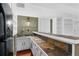 Bar area features slate countertops, built-in cabinets and shelving, and a sink at 10775 Shallowford Rd, Roswell, GA 30075