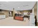 Finished basement featuring a drop ceiling, carpeted floors, and an office area at 10775 Shallowford Rd, Roswell, GA 30075