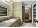 Bathroom featuring a tile shower and slate countertops at 10775 Shallowford Rd, Roswell, GA 30075