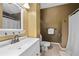 This full bathroom features a shower/tub and light colored tile floors at 10775 Shallowford Rd, Roswell, GA 30075