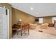 Large bonus room features living and dining areas, offering space for multiple activities at 10775 Shallowford Rd, Roswell, GA 30075