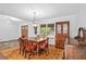 Charming dining room with hardwood floors, antique furniture, and a warm inviting ambiance at 10775 Shallowford Rd, Roswell, GA 30075