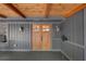 Close up on craftsman style double doors and covered porch with wood ceiling at 10775 Shallowford Rd, Roswell, GA 30075