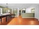 Open living room features tile floors, shelving, and an open floor plan with natural light at 10775 Shallowford Rd, Roswell, GA 30075
