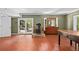 Bright living room featuring a wood stove, tile floors, and access to the exterior at 10775 Shallowford Rd, Roswell, GA 30075