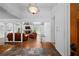 Inviting living room features hardwood floors, stone fireplace, and comfortable leather seating at 10775 Shallowford Rd, Roswell, GA 30075