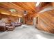 Unique living room with wood walls, vaulted ceilings with skylights and built-in shelving at 10775 Shallowford Rd, Roswell, GA 30075