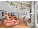Bright living room with vaulted ceilings, stone fireplace, hardwood floors, and comfortable seating at 10775 Shallowford Rd, Roswell, GA 30075
