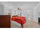 Bright main bedroom features plush carpet, ceiling fan, and natural light; with an ensuite bathroom at 10775 Shallowford Rd, Roswell, GA 30075