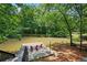 Scenic view of the pond with a seating area to enjoy the beautiful nature setting at 10775 Shallowford Rd, Roswell, GA 30075