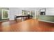 Large room with terracotta floors, shelving and window. Sewing tables at 10775 Shallowford Rd, Roswell, GA 30075