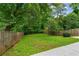 Large backyard featuring a privacy fence, mature trees and lush green space at 34 Montgomery Se St, Atlanta, GA 30317