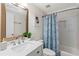 Clean bathroom features a tub with shower, white subway tile, and modern fixtures at 34 Montgomery Se St, Atlanta, GA 30317