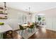 Well-lit dining area featuring an oval table, views into the living room, and modern decor at 34 Montgomery Se St, Atlanta, GA 30317
