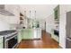Open kitchen features stainless appliances, green cabinets, and an eat-in kitchen at 34 Montgomery Se St, Atlanta, GA 30317