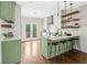 Stylish kitchen with an island, marble countertops, modern appliances and bar stool seating at 34 Montgomery Se St, Atlanta, GA 30317