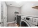Functional laundry room with modern washer and dryer units and ample storage at 34 Montgomery Se St, Atlanta, GA 30317