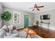 Warm living room with hardwood floors, neutral paint, modern furnishings, and a statement front door at 34 Montgomery Se St, Atlanta, GA 30317