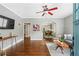 Open living room with hardwood floors flows into the dining area and kitchen at 34 Montgomery Se St, Atlanta, GA 30317