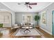 Bright living room featuring hardwood floors, modern furniture, and plenty of natural light at 34 Montgomery Se St, Atlanta, GA 30317