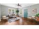 Bright living room featuring hardwood floors, a gray sofa, and natural light at 34 Montgomery Se St, Atlanta, GA 30317