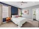 Cozy bedroom with ensuite bathroom, tray ceilings, and ample natural light from large windows at 34 Montgomery Se St, Atlanta, GA 30317