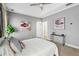 Light-filled bedroom featuring neutral paint, ceiling fan, and access to an ensuite bathroom at 34 Montgomery Se St, Atlanta, GA 30317