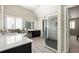 Elegant bathroom with a large glass shower, soaking tub, and double vanity with marble countertops at 374 Heritage, Woodstock, GA 30188