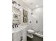 Stylish bathroom with a modern vanity, black fixtures, and a black-and-white tiled shower at 374 Heritage, Woodstock, GA 30188