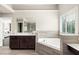 Spacious bathroom with soaking tub, double vanity, and modern tiled accents at 374 Heritage, Woodstock, GA 30188