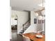 Inviting entryway with staircase and view into a stylishly furnished living room with modern decor at 374 Heritage, Woodstock, GA 30188