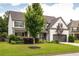 Charming two-story home with a well-maintained lawn, mature trees, and a two-car garage, set in a peaceful neighborhood at 374 Heritage, Woodstock, GA 30188