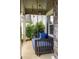 Inviting front porch featuring a charming porch swing and stylish lighting at 374 Heritage, Woodstock, GA 30188