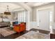Elegant living room featuring hardwood floors, a stylish chandelier, and comfortable seating arrangements with chic accents at 374 Heritage, Woodstock, GA 30188