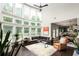 Bright living room boasts a soaring wall of windows, high ceilings, and an open floor plan at 374 Heritage, Woodstock, GA 30188