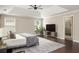 Spacious main bedroom with tray ceiling, neutral walls, and view of the ensuite bathroom at 374 Heritage, Woodstock, GA 30188