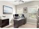 Functional home office with a large desk, comfortable chair, and ample natural light at 374 Heritage, Woodstock, GA 30188