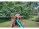 View of a playset with a slide and swing set in the backyard at 4345 Tucker North Dr, Tucker, GA 30084