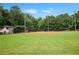Well-maintained baseball field with a grassy outfield and a fenced-in backstop at 4345 Tucker North Dr, Tucker, GA 30084