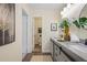 Modern bathroom with granite countertop vanity, round mirrors, and neutral decor at 4345 Tucker North Dr, Tucker, GA 30084