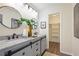 Modern bathroom featuring double sinks, granite countertops, and a walk-in closet at 4345 Tucker North Dr, Tucker, GA 30084