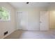 Bright bedroom with closet, window, and neutral carpet at 4345 Tucker North Dr, Tucker, GA 30084