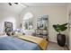 Tranquil bedroom features vaulted ceilings, a large window, and stylish decor at 4345 Tucker North Dr, Tucker, GA 30084